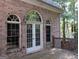 Brick house back with french doors and deck at 5335 Saville Dr, Acworth, GA 30101
