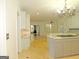 Open kitchen with island, granite counters, and hardwood floors at 5335 Saville Dr, Acworth, GA 30101