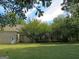 Spacious backyard with large deck and mature trees at 5335 Saville Dr, Acworth, GA 30101