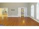 Hardwood floor living room with views into kitchen and staircase at 5335 Saville Dr, Acworth, GA 30101