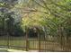 Landscaped backyard with wooden fence and arbor at 5335 Saville Dr, Acworth, GA 30101