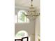 Grand foyer with crystal chandelier and arched windows at 5335 Saville Dr, Acworth, GA 30101