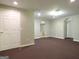 Finished basement with carpet, recessed lighting, and two arched entryways at 5335 Saville Dr, Acworth, GA 30101