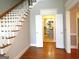 Two-story entryway with hardwood floors, staircase, and view into kitchen at 5335 Saville Dr, Acworth, GA 30101
