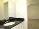 Bathroom with granite countertop, sink, and mirror at 5335 Saville Dr, Acworth, GA 30101