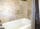 Bathroom with beige tile and a shower/tub at 5335 Saville Dr, Acworth, GA 30101