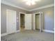 Bedroom with carpet, two doors, and a closet at 5335 Saville Dr, Acworth, GA 30101