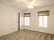 Well-lit bedroom with carpet, window, and closet at 5335 Saville Dr, Acworth, GA 30101