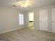 Bright bedroom with gray carpet, plantation shutters, and ceiling fan at 5335 Saville Dr, Acworth, GA 30101