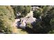 Aerial view of house, showcasing backyard, driveway and surrounding trees at 5335 Saville Dr, Acworth, GA 30101
