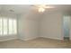 Spacious bedroom with neutral walls, carpet and window shutters at 5335 Saville Dr, Acworth, GA 30101