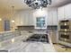 Modern kitchen with granite countertops, stainless steel appliances and a large island at 5335 Saville Dr, Acworth, GA 30101