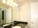 Bathroom with granite countertop, sink, and light fixture at 5335 Saville Dr, Acworth, GA 30101