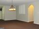Finished basement with a chandelier and archway at 5335 Saville Dr, Acworth, GA 30101