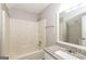 Bathroom with granite vanity, shower/tub combo, and mirror at 195 Pine Branch Dr, Stockbridge, GA 30281