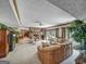 Open concept basement with multiple seating areas and a brick fireplace at 655 Mcdonough Rd, Hampton, GA 30228