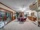 Spacious basement recreation room with fireplace, wet bar, and spiral staircase at 655 Mcdonough Rd, Hampton, GA 30228