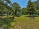 Open field with antique farm equipment, offering a tranquil setting at 655 Mcdonough Rd, Hampton, GA 30228
