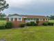Brick ranch house featuring a classic design and curb appeal at 655 Mcdonough Rd, Hampton, GA 30228