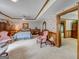 Spacious basement bedroom with a queen-size bed and access to a hallway at 655 Mcdonough Rd, Hampton, GA 30228