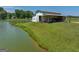 White barn situated on the edge of a tranquil lake at 655 Mcdonough Rd, Hampton, GA 30228