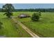 Aerial view of a ranch style home on a large lot with a long driveway at 655 Mcdonough Rd, Hampton, GA 30228