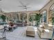 Sunroom featuring tiled floors, plush seating, and picturesque garden views at 655 Mcdonough Rd, Hampton, GA 30228