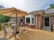 Deck with patio furniture and umbrella, offering scenic views at 655 Mcdonough Rd, Hampton, GA 30228