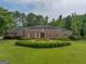 Brick ranch house with manicured lawn at 655 Mcdonough Rd, Hampton, GA 30228