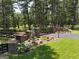 Landscaped entrance with brick pillars and a black metal gate, leading to a private property at 655 Mcdonough Rd, Hampton, GA 30228