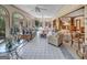 Bright sunroom with tiled floor, ample seating, and views of the backyard at 655 Mcdonough Rd, Hampton, GA 30228