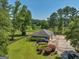 Aerial view showcasing home, detached garage, and picturesque pond at 655 Mcdonough Rd, Hampton, GA 30228