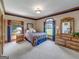 Bedroom with wooden furniture and window view at 655 Mcdonough Rd, Hampton, GA 30228