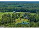 Wide shot of property highlighting home, pond, and surrounding landscape at 655 Mcdonough Rd, Hampton, GA 30228