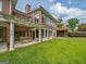 Brick house with a large backyard, covered patio, and deck at 655 Mcdonough Rd, Hampton, GA 30228