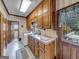 Laundry room with wooden cabinets and access to backyard at 655 Mcdonough Rd, Hampton, GA 30228
