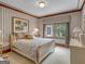 Bedroom with a queen-size bed, window view, and nightstands at 655 Mcdonough Rd, Hampton, GA 30228