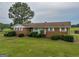 Brick ranch house with well-maintained landscaping at 655 Mcdonough Rd, Hampton, GA 30228