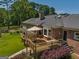 Relaxing deck with patio furniture, overlooking the backyard at 655 Mcdonough Rd, Hampton, GA 30228