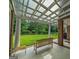 Peaceful covered patio overlooking a lush green lawn at 655 Mcdonough Rd, Hampton, GA 30228