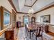 Formal dining room with hardwood floors, chandelier, and large windows at 655 Mcdonough Rd, Hampton, GA 30228