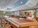 Long basement bar with seating and views into the recreation area at 655 Mcdonough Rd, Hampton, GA 30228