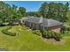 Brick home with manicured landscaping and a circular driveway at 655 Mcdonough Rd, Hampton, GA 30228