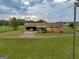 Ranch house with carport and spacious lawn at 655 Mcdonough Rd, Hampton, GA 30228