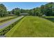 Stunning aerial view of a home with pond, gazebo, and expansive lawn at 655 Mcdonough Rd, Hampton, GA 30228