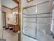 Bathroom with shower and tub, vanity with sink and mirror at 655 Mcdonough Rd, Hampton, GA 30228