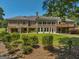 Brick house back view with pergola, deck, and expansive windows at 655 Mcdonough Rd, Hampton, GA 30228