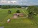 Aerial view of a ranch home on acreage with a detached garage and storage building at 655 Mcdonough Rd, Hampton, GA 30228