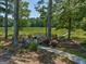Lakeside deck with seating and fire pit, offering scenic views at 655 Mcdonough Rd, Hampton, GA 30228