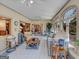 Sunroom showcasing tiled flooring, comfy seating and views into the dining area at 655 Mcdonough Rd, Hampton, GA 30228